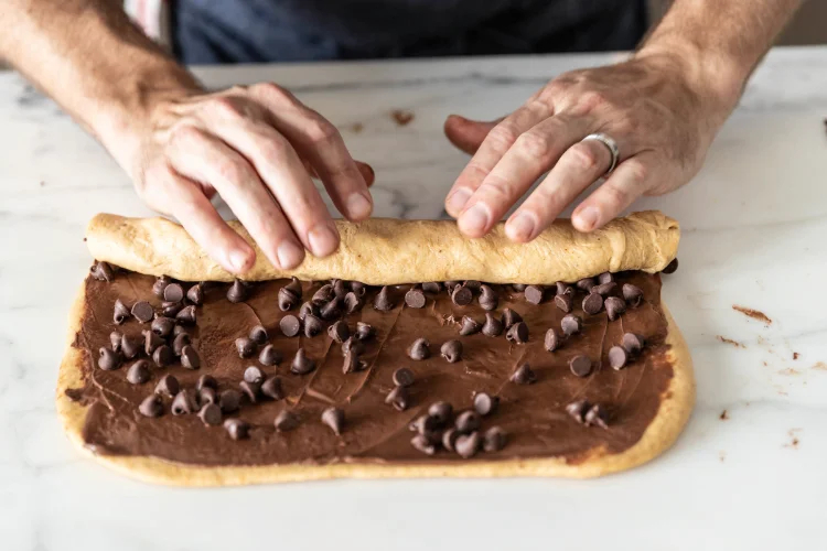 Image of Sprinkle 1⁄2 cup chocolate chips (90 grams) evenly over the...